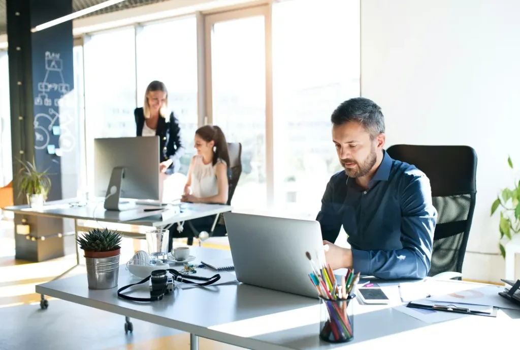 A team working together in a bright open-plan office
